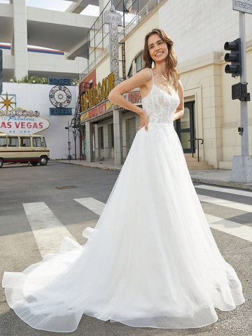 Lace Stitched Floor-Length Wedding Dress With Large Hemline And Spaghetti Straps